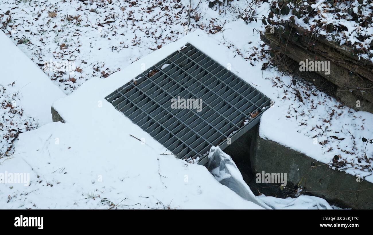 Sewerage on the Winter Snowy Park Stock Photo