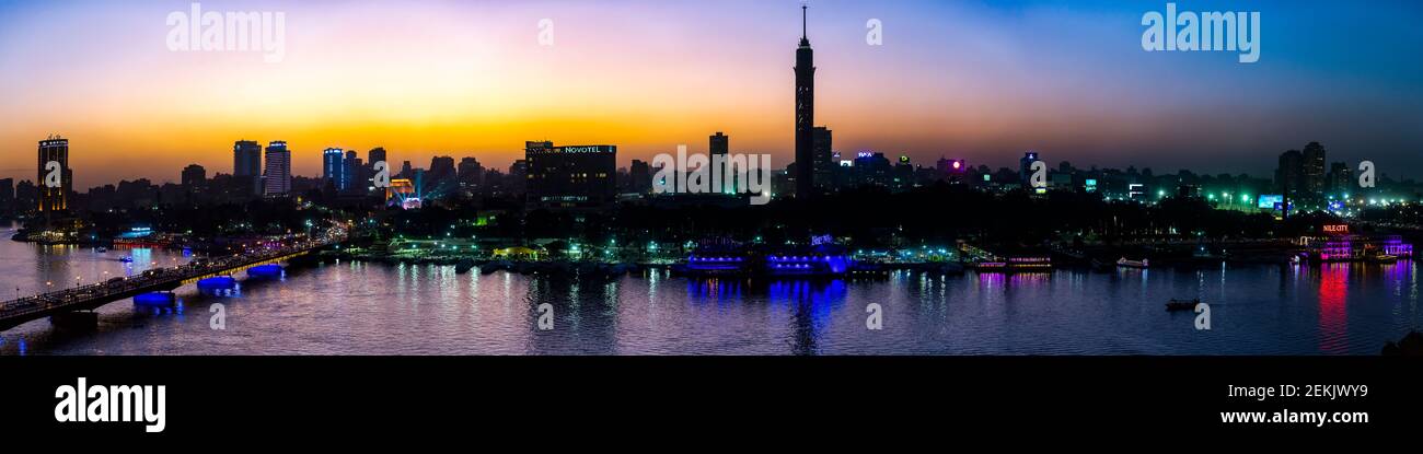 Cityscape with Cairo Tower at dusk, Cairo, Egypt Stock Photo
