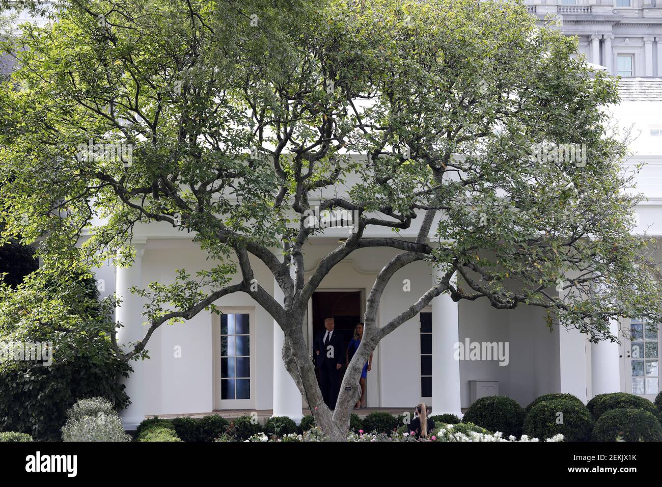 U.S. President Donald Trump walks out from the Oval Office of the White ...