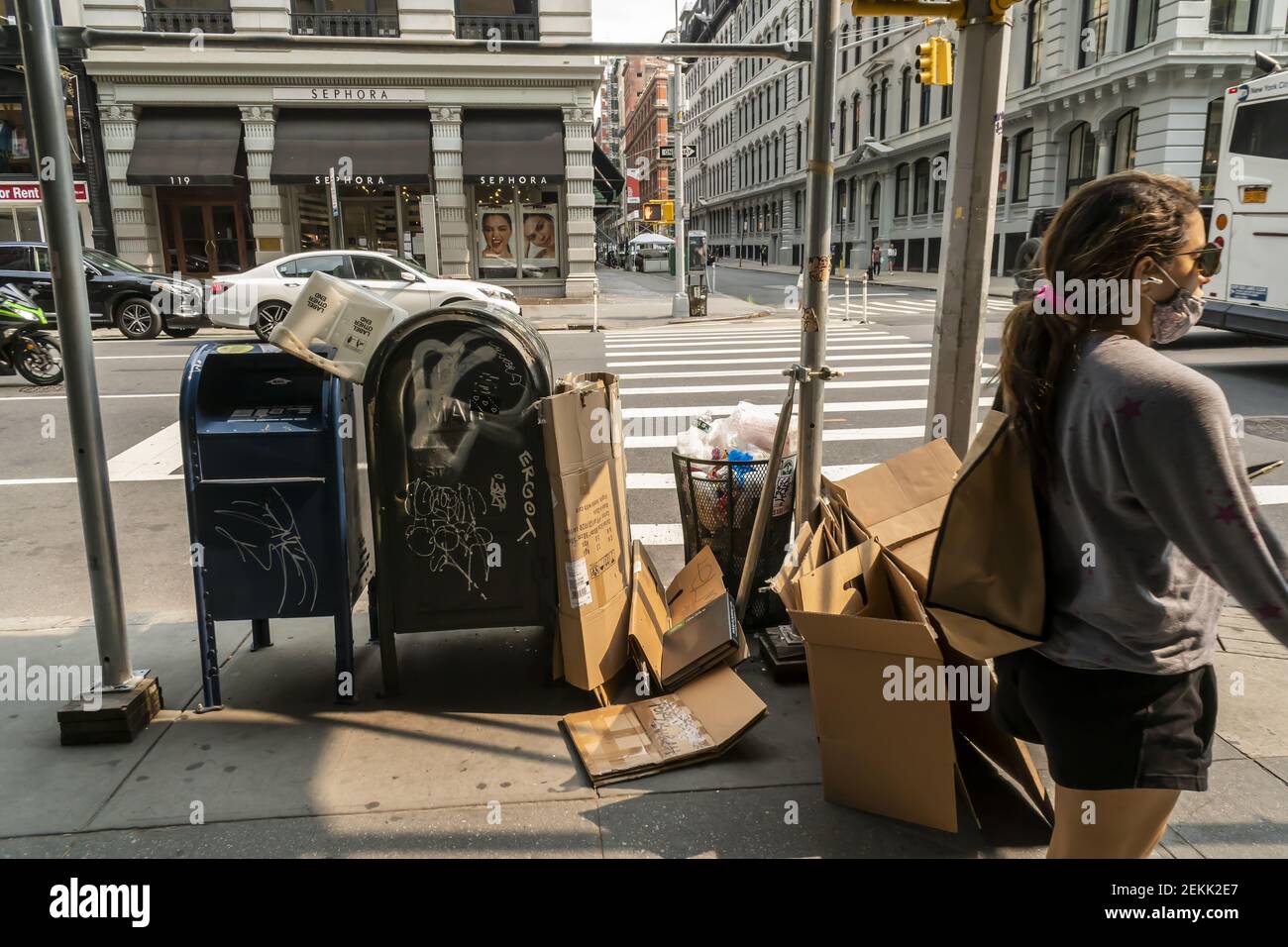 A fine selection of garbage from an overflowing street trash receptacle