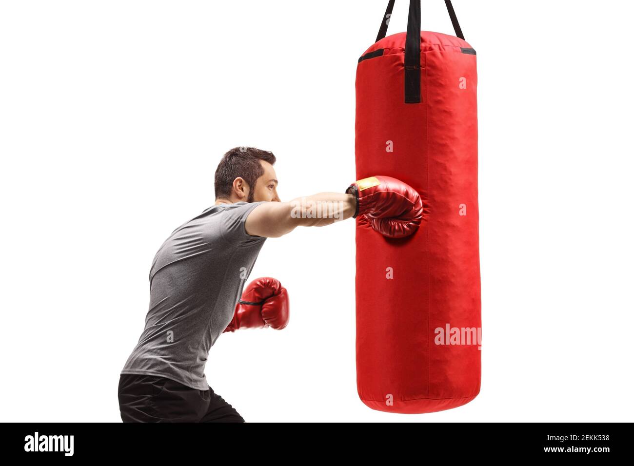 Muscular man training box with a punching bag isolated on white