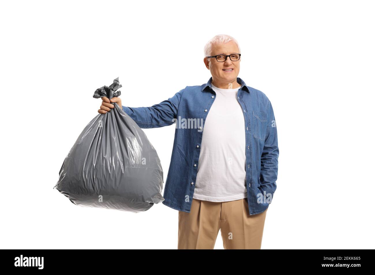 Mature man holding a bin bag isolated on white background Stock Photo