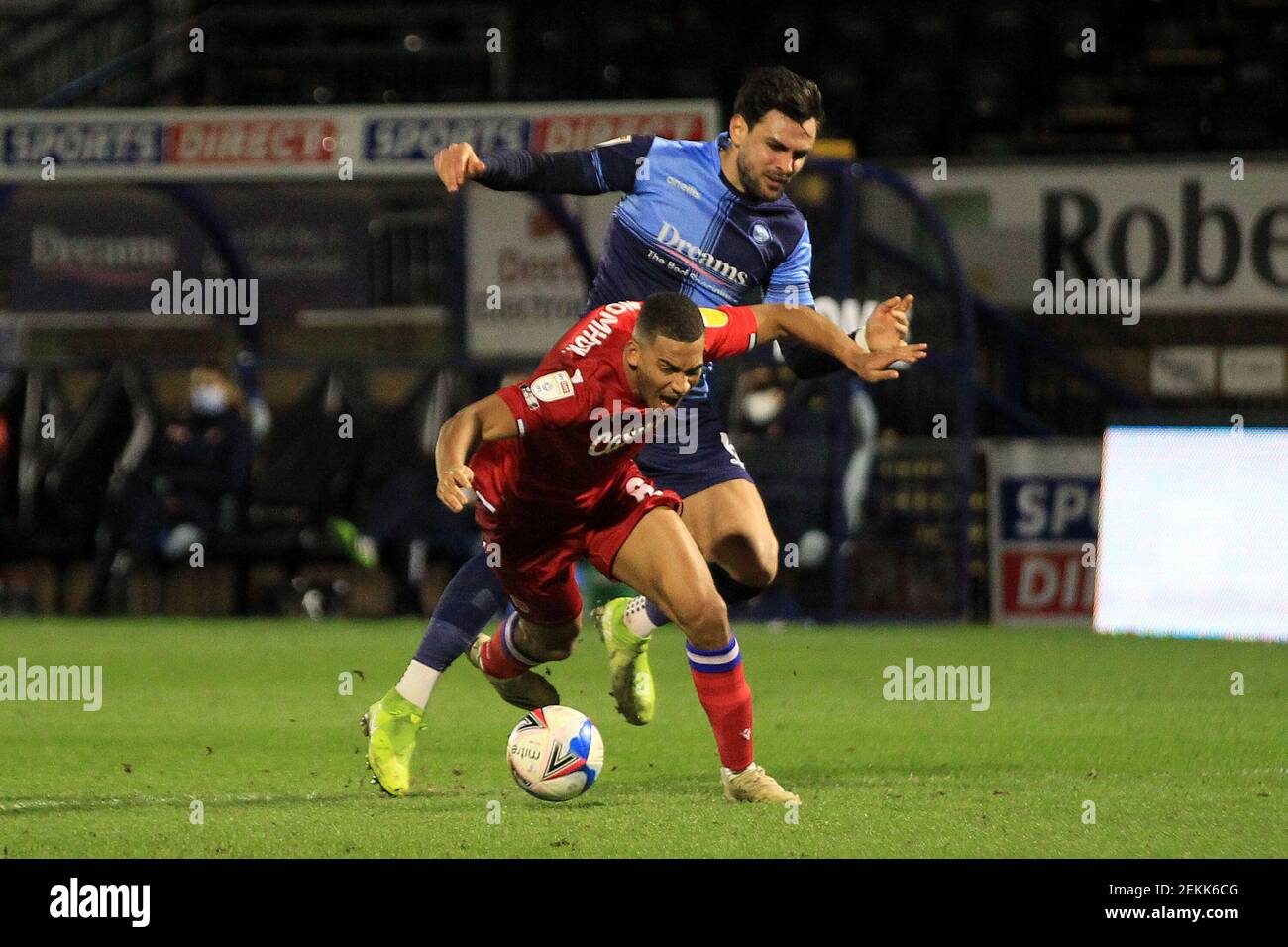 High Wycombe, UK. 23rd Feb, 2021. Ryan Tafazolli of Wycombe (R) Wanderers concedes a penalty and is red carded and sent off after fouling Andy Rinomhota of Reading (L). EFL Skybet Championship match, Wycombe Wanderers v Reading at Adams Park Stadium in High Wycombe, Buckinghamshire on Tuesday 23rd February 2021 . this image may only be used for Editorial purposes. Editorial use only, license required for commercial use. No use in betting, games or a single club/league/player publications. pic by Steffan Bowen/Andrew Orchard sports photography/Alamy Live news Stock Photo