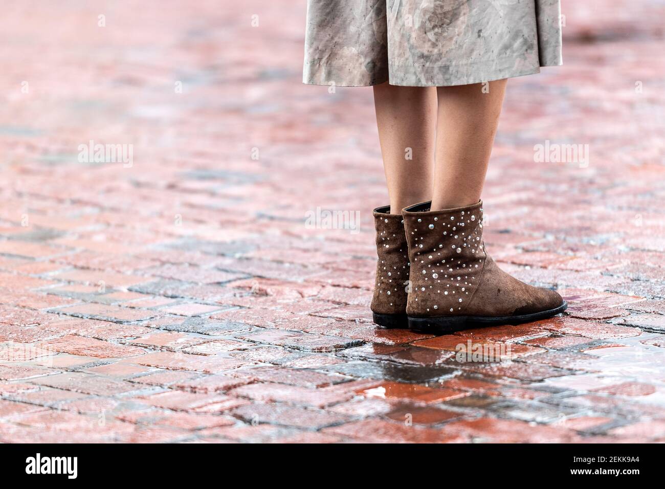 Feet in wet floor, distelliry district, Toronto, Canada Stock Photo