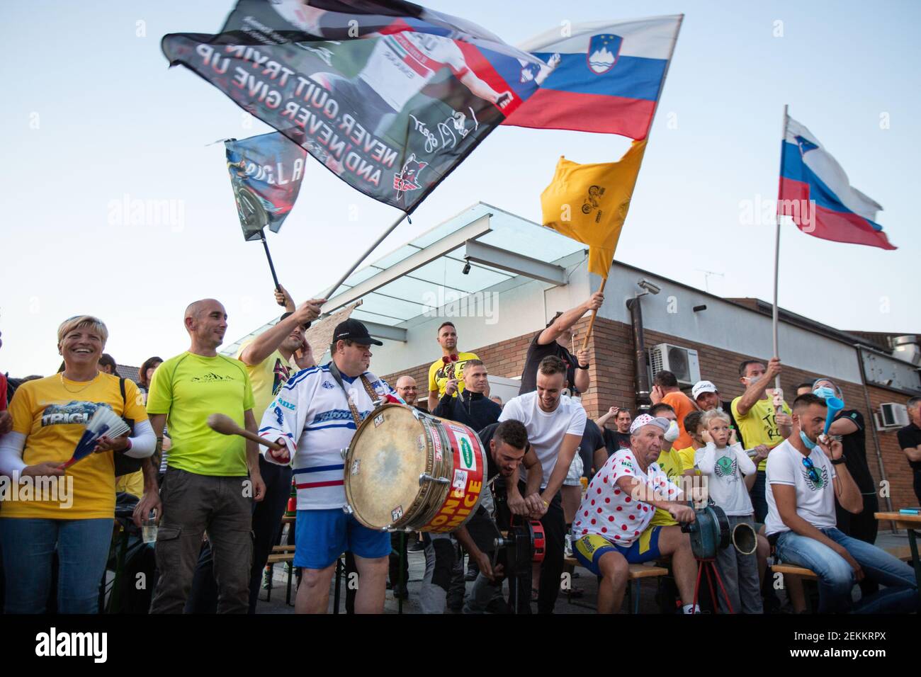 Fans wave flags in support of Slovenian cyclists Tadej Pogacar and Primoz  Roglic during the celebration. As Tadej Pogacar of Slovenia won this year's  Tour de France, people gathered in Komenda, his