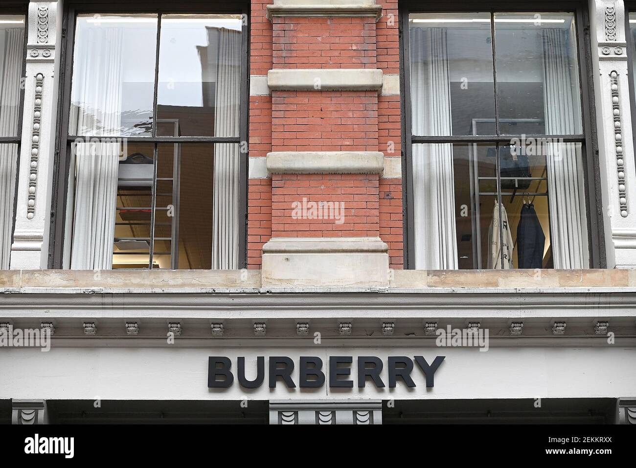 UK luxury fashion brand Burberry logo at its retail store in the Soho  neighborhood of New York, NY, February 23, 2021. British and Italian  Fashion Week shows are underway in Europe this