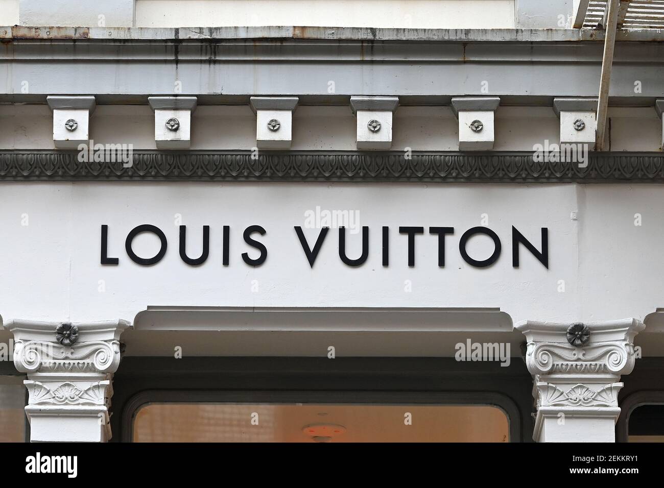 French luxury brand Louis Vuitton logo above its retail store in the Soho  neighborhood of New York, NY, February 23, 2021. British and Italian  Fashion Week shows are underway in Europe this