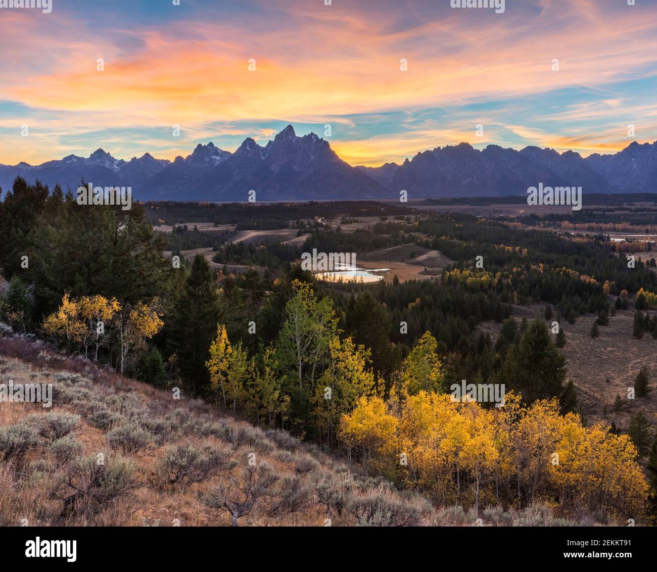 Grand Teton National Park, WY: Colorful sunset over the Teton Range overlooking the Snake River Valley Stock Photo