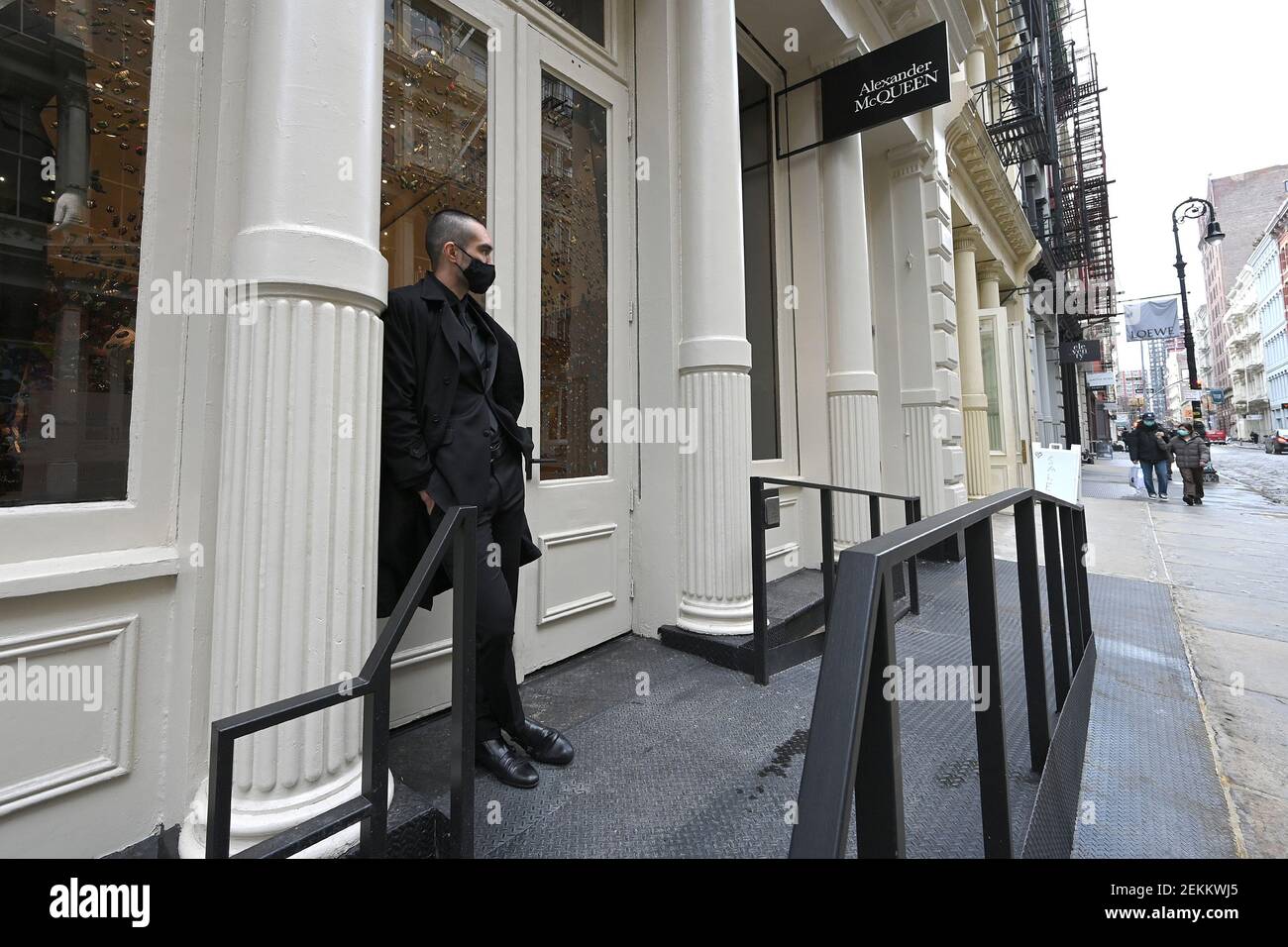 New York, USA. 23rd Feb, 2021. A security guard stands outside of UK  designer Alexander McQueen retail store in the Soho neighborhood of New  York, NY, February 23, 2021. British and Italian