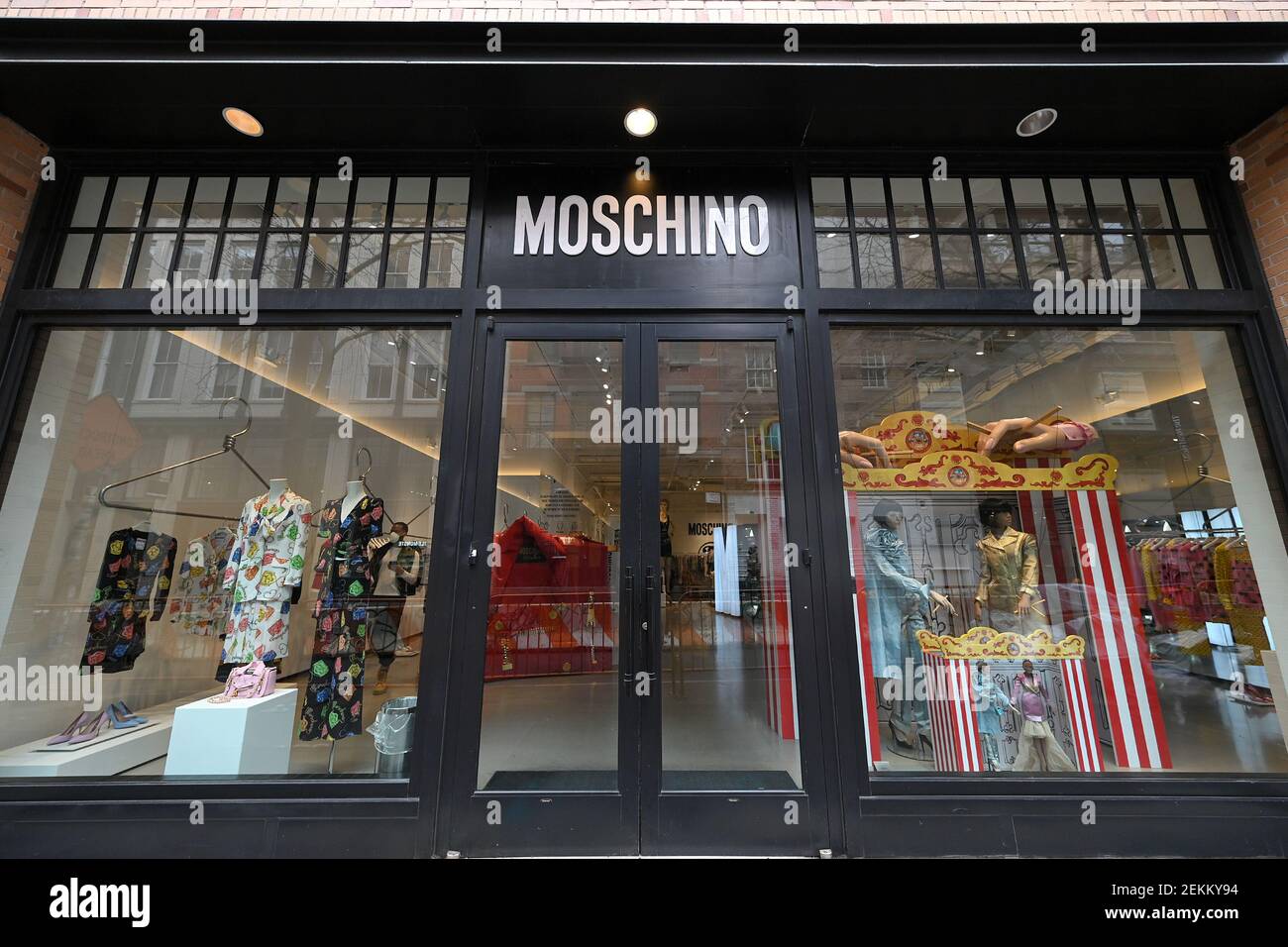 Italian luxury brand Moschino name above the front entrance of its retail  store in the Soho neighborhood of New York, NY, February 23, 2021. British  and Italian Fashion Week shows are underway