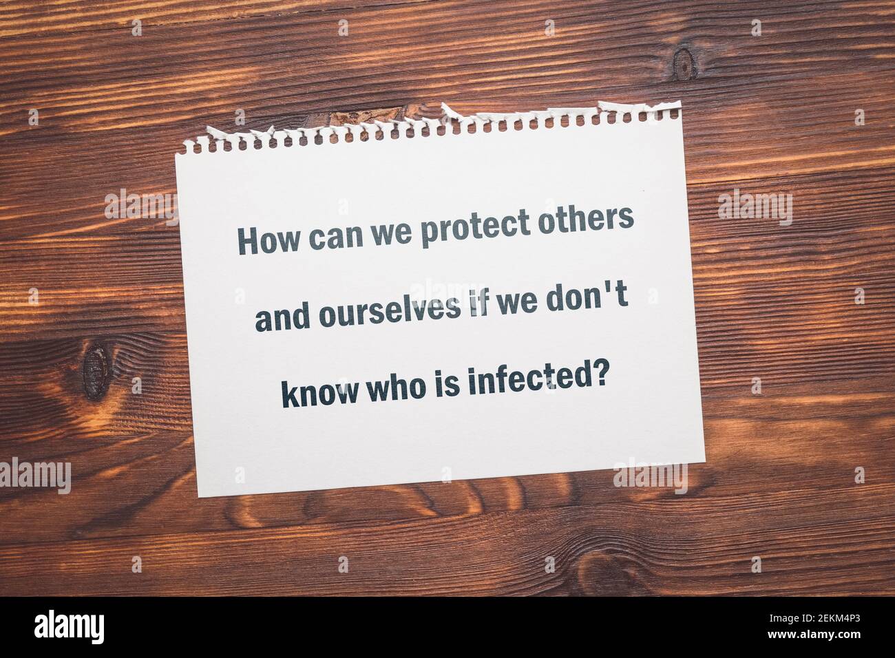 The question about coronavirus - How can we protect others and ourselves if we don't know who is infected. Stock Photo