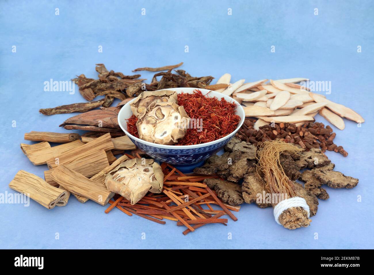 Traditional Chinese herbs & spice used in traditional herbal medicine in a bowl and loose on