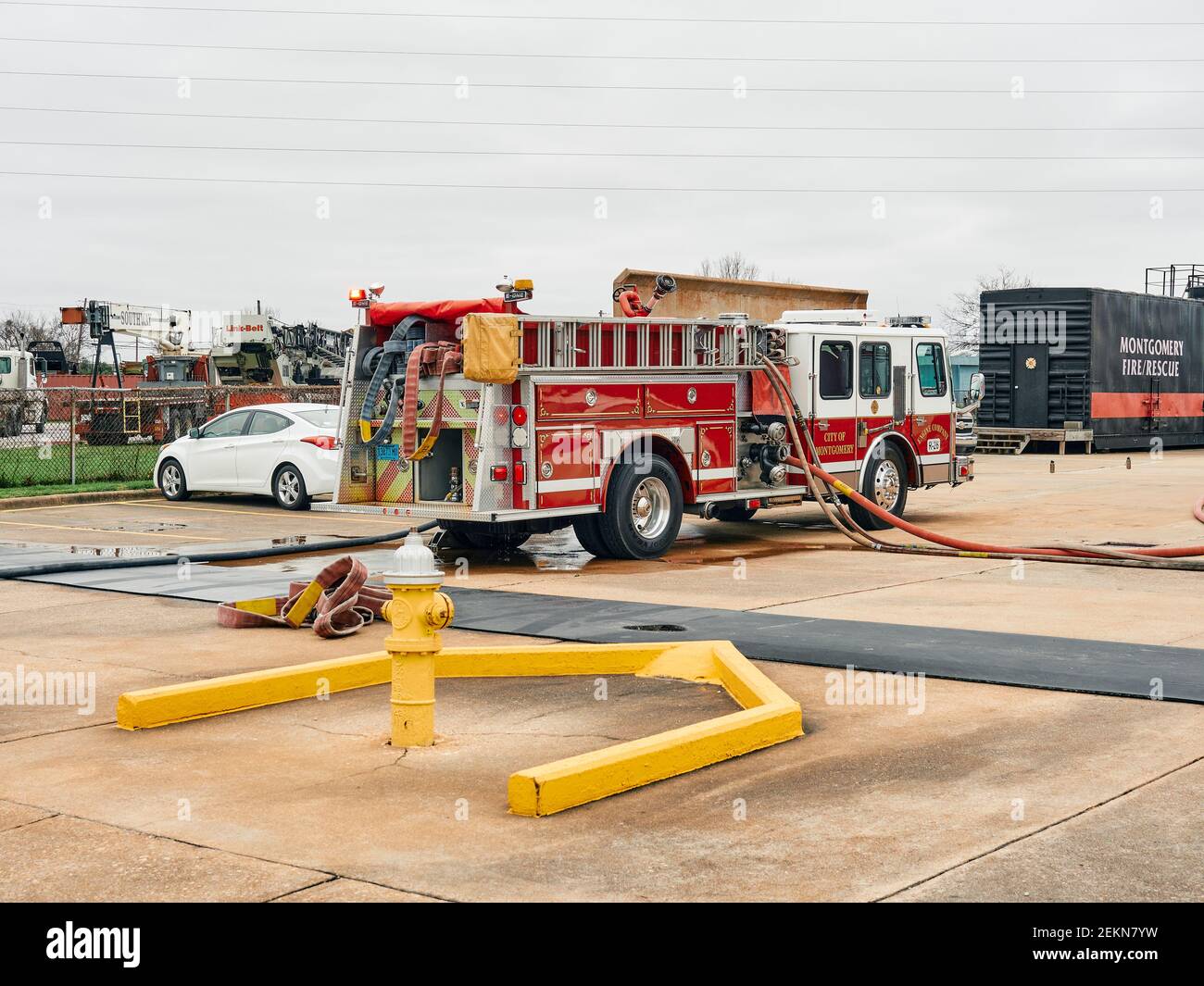 Montgomery Fire Rescue fire truck or fire engine pumper providing water to firefighters in Montgomery Alabama, USA. Stock Photo