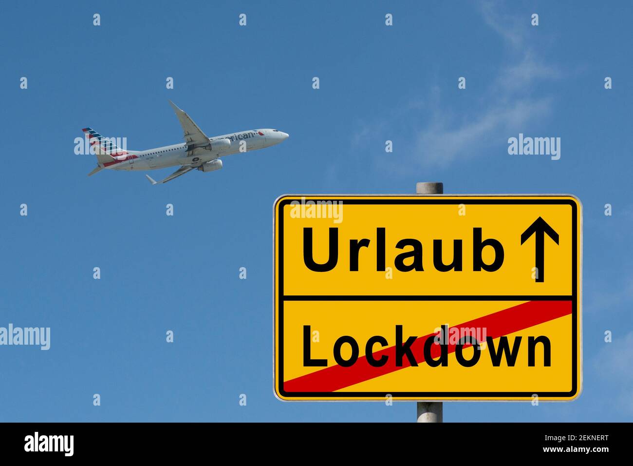 symbolic picture, end of lockdown, start vacation, travelling, composing, yellow German city limit sign, passenger plane taking off, Germany Stock Photo