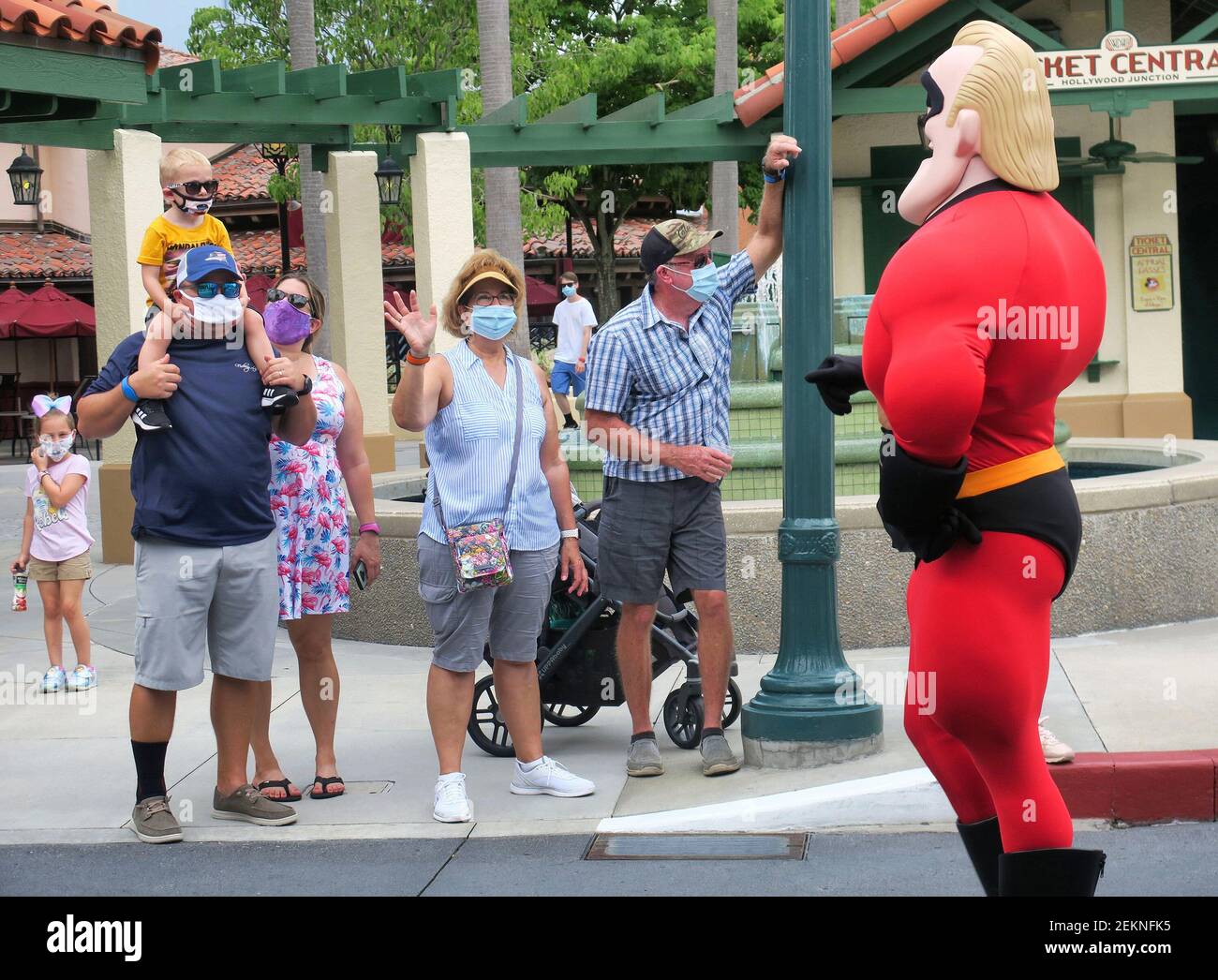 Guests wave to Mr. Incredible during a pop-up appearance of Pixar characters at Disney's Hollywood Studios at Walt Disney World, on the second day of the park's re-opening, in Lake Buena Vista, Florida, on Thursday, July 16, 2020. All four of Disney's Florida parks are now open, including Epcot, the Magic Kingdom and Animal Kingdom, with limited capacity and safety protocols in place in response to the coronavirus pandenmic. (Joe Burbank/Orlando Sentinel/TNS) Stock Photo