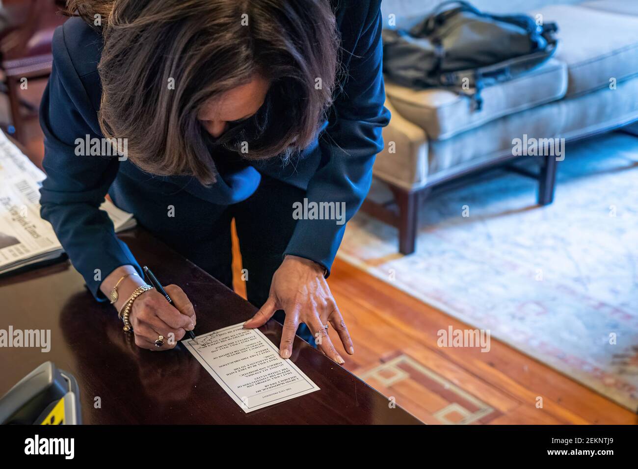 Vice President Kamala Harris signs Secretary of Veterans Affairs Denis McDonough’s oath used during his swearing-in ceremony Tuesday, Feb. 9, 2021, in the Vice President’s Ceremonial Office in the Eisenhower Executive Office Building of the White House. (Official White House Photo by Lawrence Jackson) Stock Photo