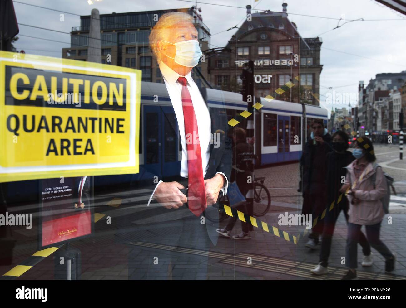 The wax figure of US President Donald Trump wear face mask are seen in the window with sign caution quarentine area at the Madame Tussaud downtown Amsterdam amid the Coronavirus pandemic on October 2, 2020 in Amsterdam,Netherlands. Trump and his wife Melania have tested positive for with the coronavirus are quarantined at the White House. (Photo by Paulo Amorim/Sipa USA) Stock Photo