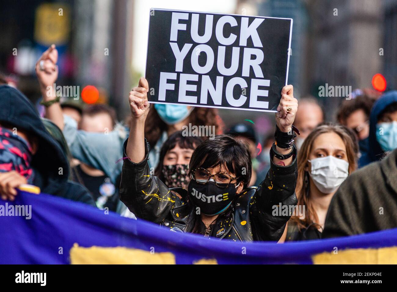 A demonstrator holds up a sign at a protest against corporations doing business with Immigration and Customs Enforcement on October 2, 2020, in New York City. (Photo by Gabriele Holtermann/Sipa USA) Stock Photo