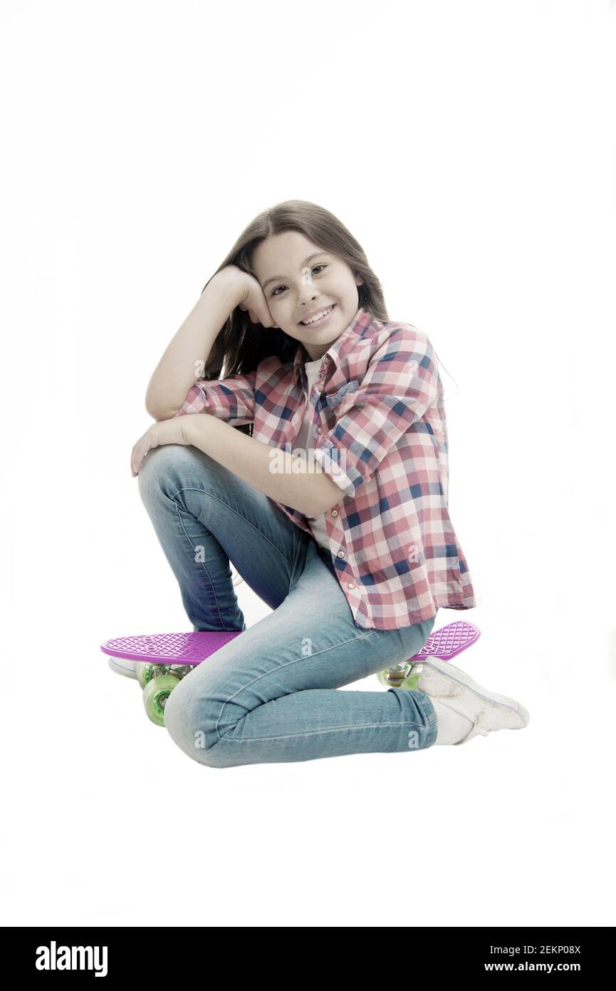 Happy child sit on penny board isolated on white. Little girl smile with  beauty look. Carefree kid with skateboard. Casual fashion and style.  Skateboarding is a fun Stock Photo - Alamy