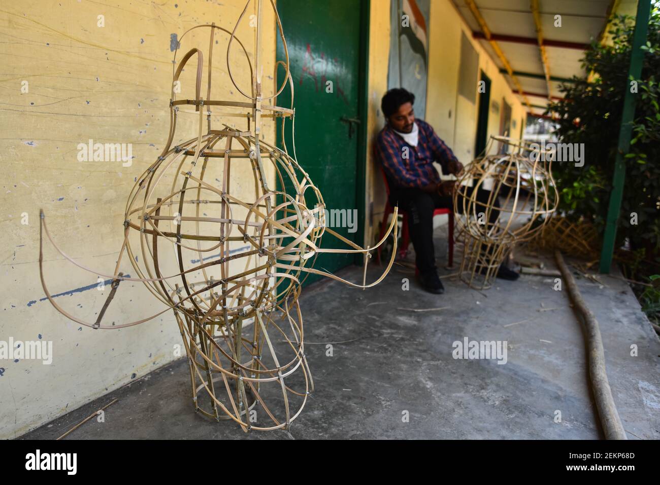 NEW DELHI, INDIA - OCTOBER 3: A man makes an effigy Hindu mythological ...