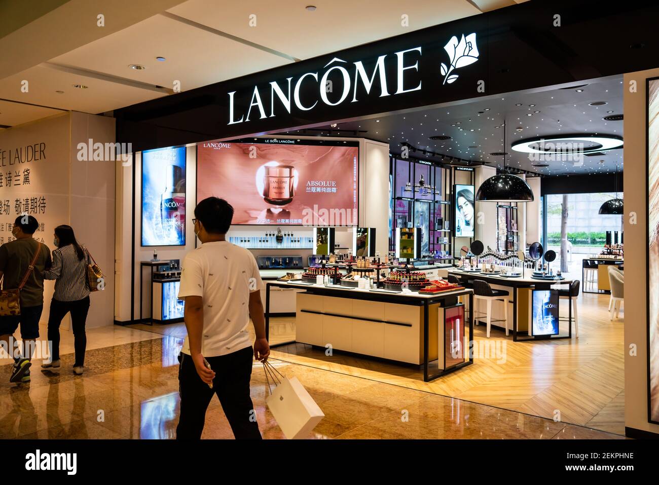 File--Customers walk into an LV boutique in Shenzhen, China, 14
