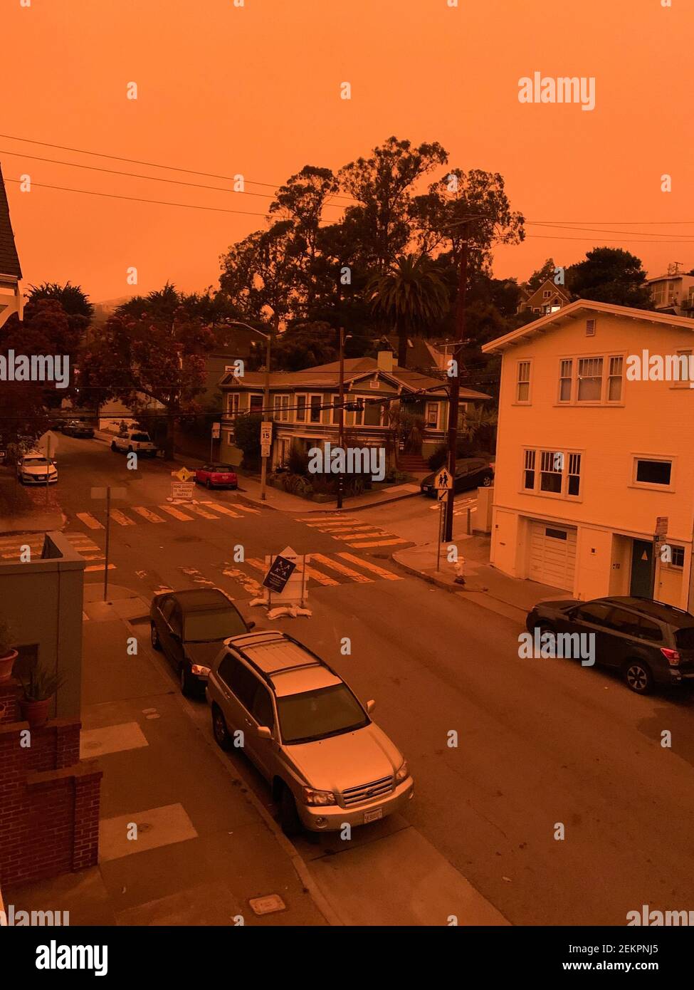 San Francisco's Glen Park neighborhood at 9:55 am Pacific Daylight Time on  Wednesday, September 9, 2020. Smoke from numerous wildfires over a layer of  marine fog turned the sky an eerie orange