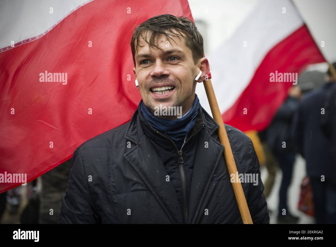 Michal Kolodziejczak waving the Polish flag during the march. To oppose the  so-called "Five for animals" act (Piatka dla zwierzat), Agrounia, the  farmers' organisation lead by Michal Kolodziejczak marched through the  streets,