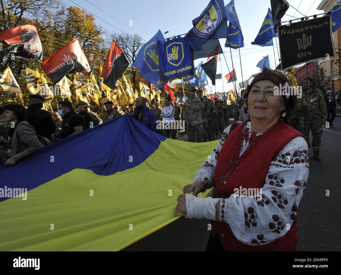 Activists marching with a huge Ukrainian flag during the rally ...