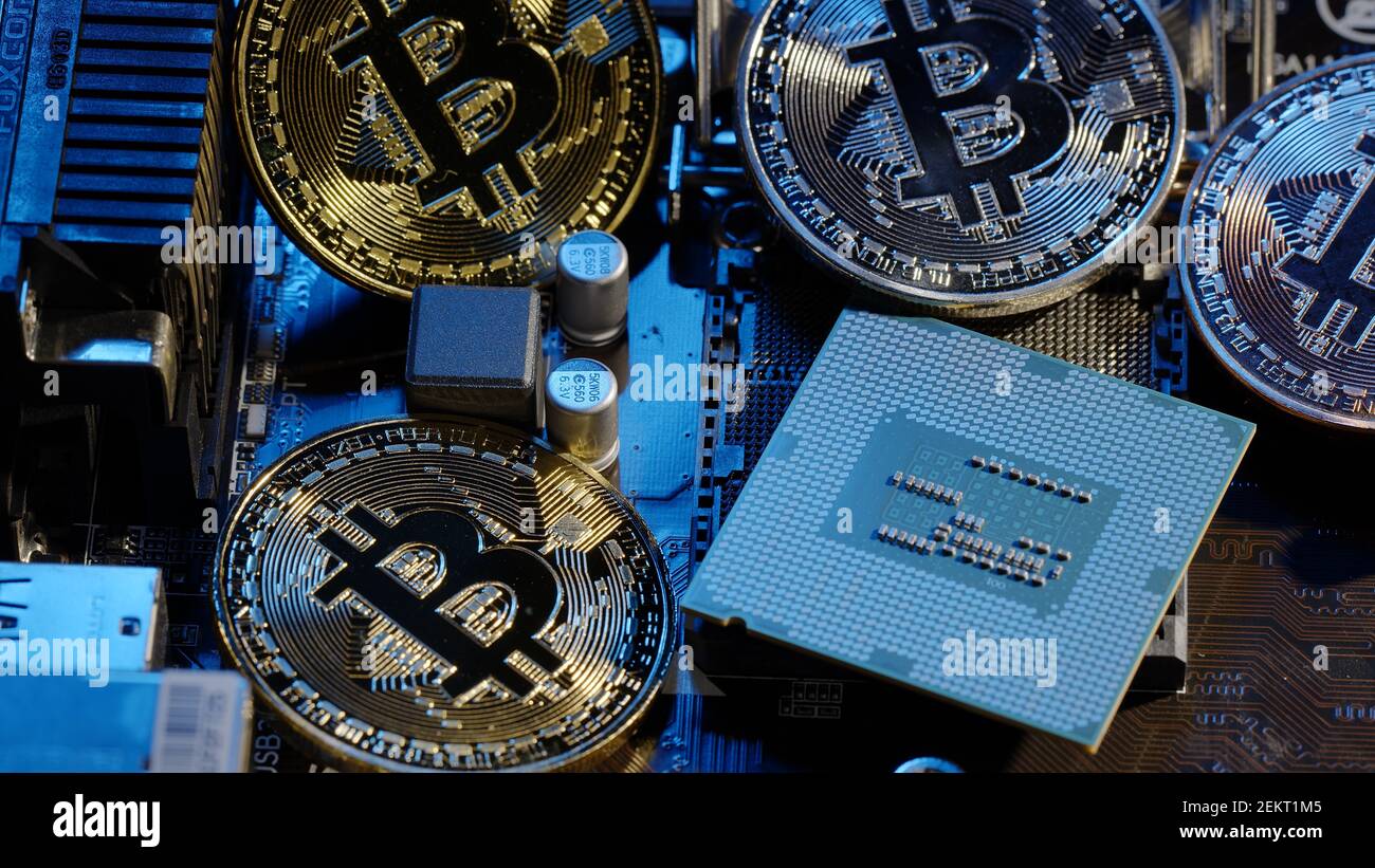 Bitcoin mining. BTC and CPU central processor on the digital technology pc  motherboard. Market trading cashless e-commerce. Gold bitcoin  cryptocurrency isolated on computer board. New virtual money Stock Photo -  Alamy