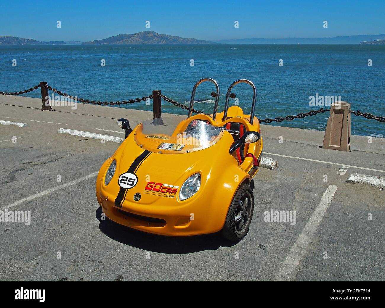 3 wheel, 2 person GoCar rental vehicle parked along the Bay at Fort Point lot in San Francisco, California Stock Photo