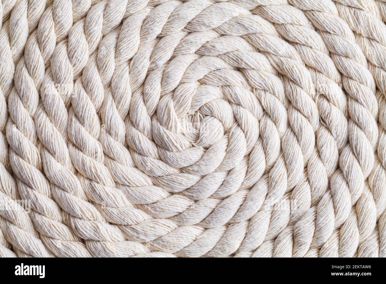 Sprial Twisted Hemp Rope Curled in a Spiral Background. Stock Photo
