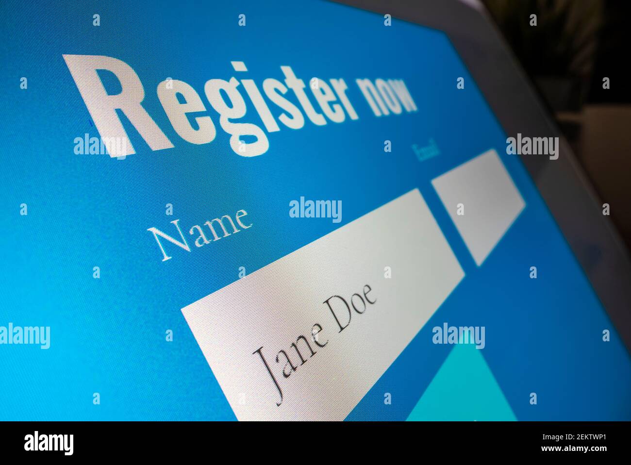 Completing registration form online Stock Photo