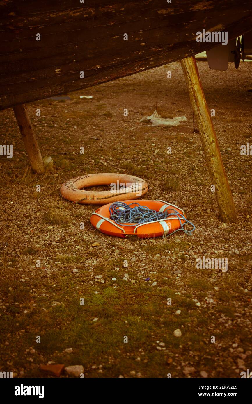 Lifesaver, life rings, floats, emergency, lifeboat accessories, swimming, safety, discarded, grounded, thrown on the ground, left behind Stock Photo