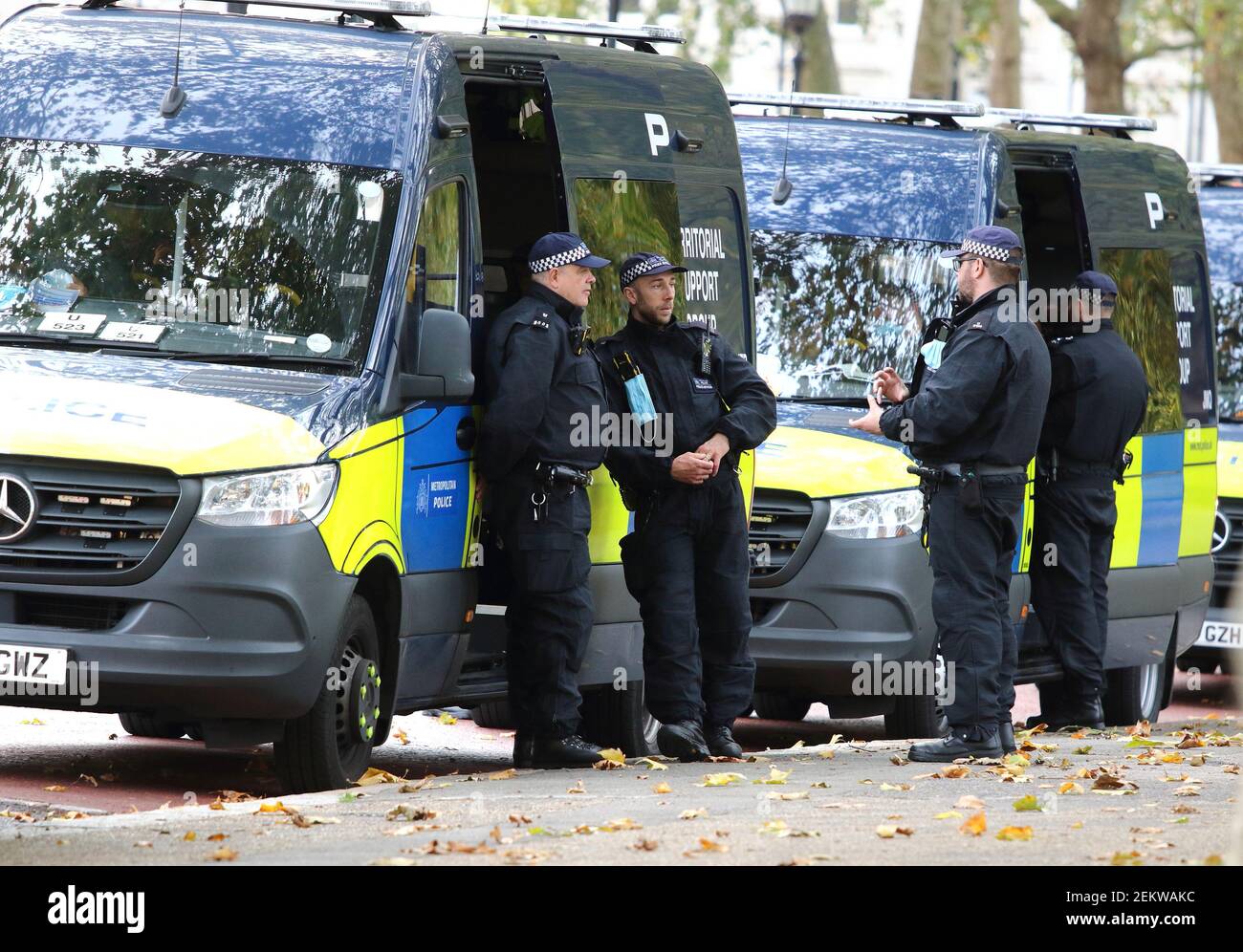 Policemen wait outside their Territorial Support Unit vans as they await a  call to action. With a number of expected demonstrations taking place in  the capital this weekend, the Metropolitan Police mobilized