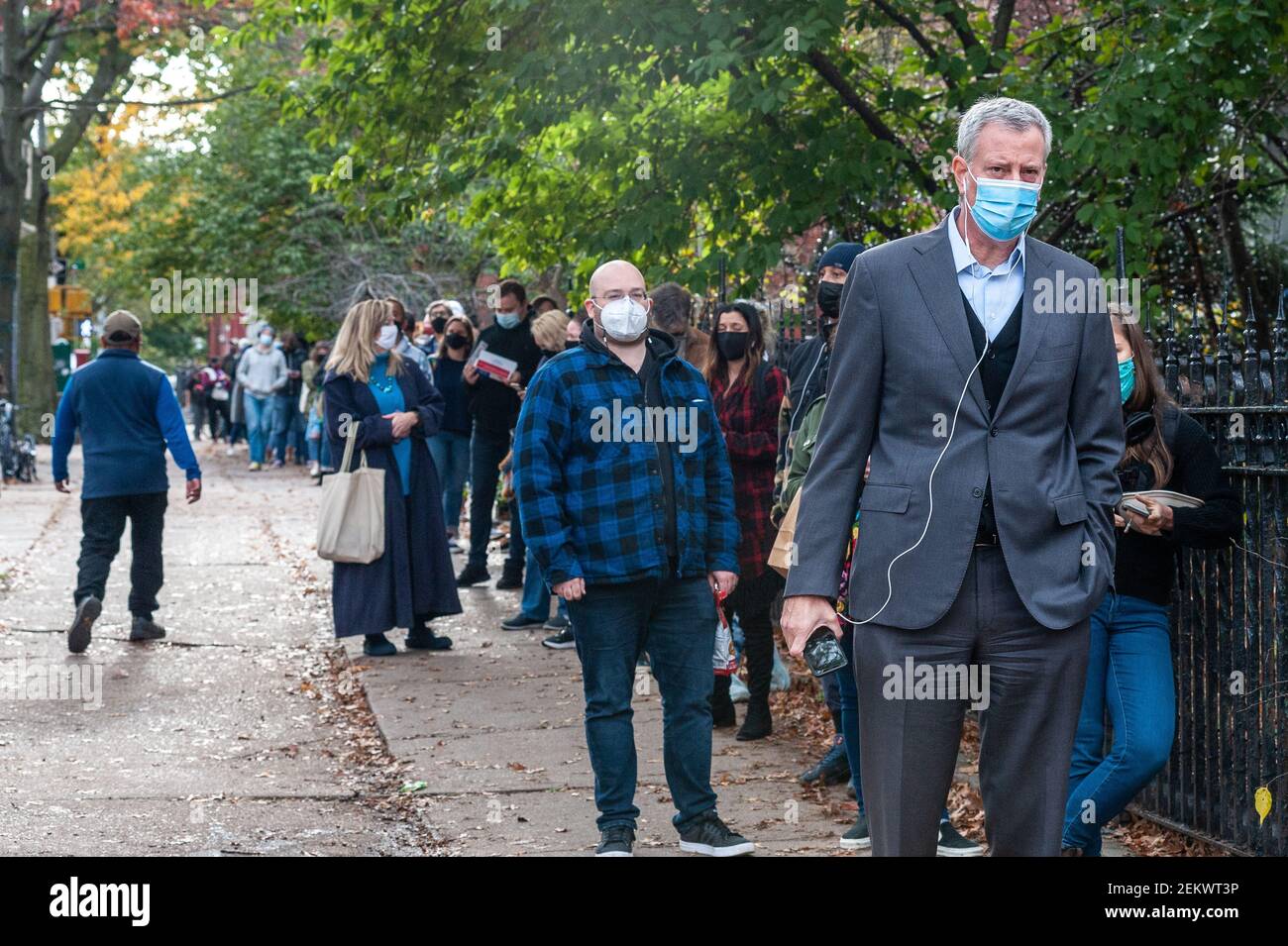 New York City Mayor Bill de Blasio stands in an over twohourlong line