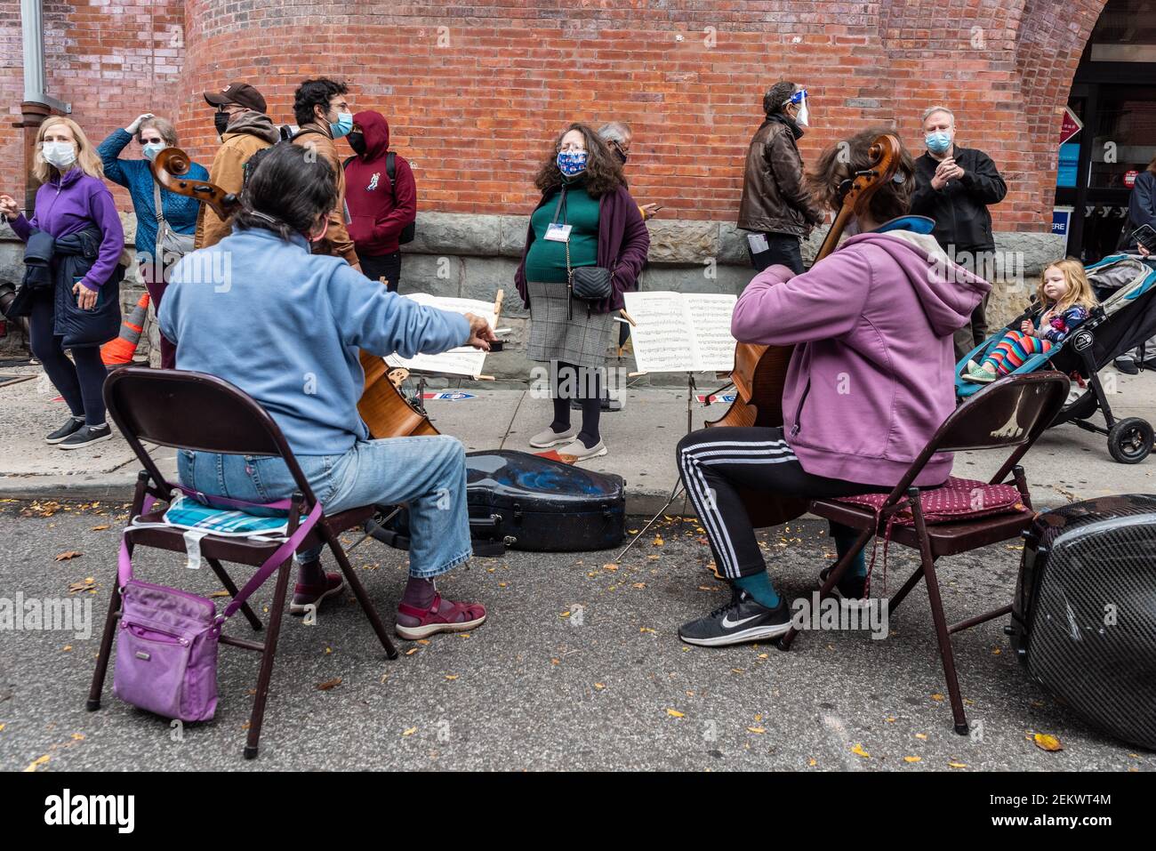 Two cellists entertain Park Slopers while they wait in an over twohour