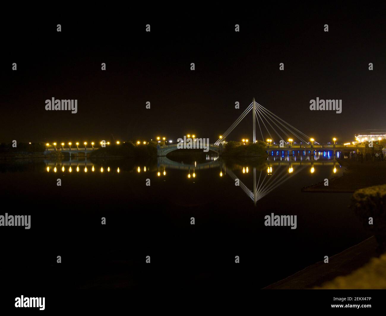 bridge at night, lights, span, architectural, lake, reflections, lit up, serene, scene, scenic, southport, seaside, merseyside, lancashire Stock Photo