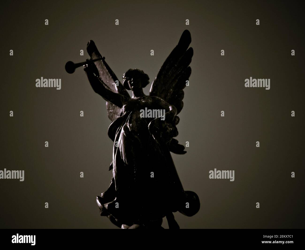 angel with trumpet statue, wings, angelic, floating, archangels, goth, gothic, religious, abstract Stock Photo