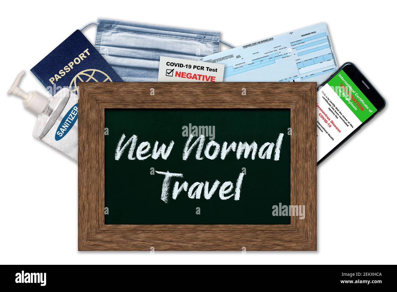 New normal travel essentials during COVID-19 restrictions with chalkboard on white background. Smartphone digital vaccination certificate, proof of PC Stock Photo
