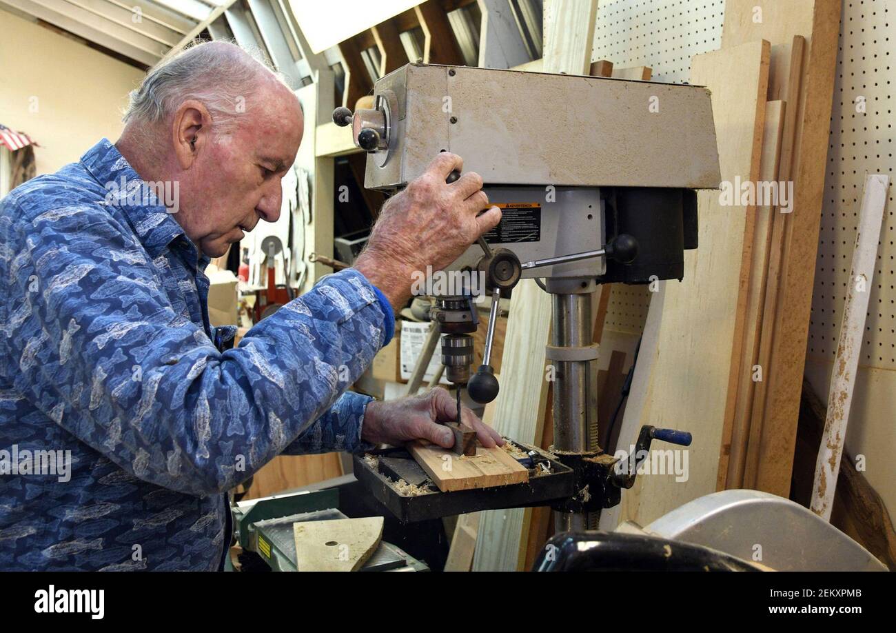 Ron Clements, a member of the Howard County Woodworkers Guild, uses a drill press in his shop as he makes wooden toy jeeps for children who are patients at the National Institutes of Health in Bethesda. (Photo by Barbara Haddock Taylor/The Baltimore Sun/TNS Stock Photo