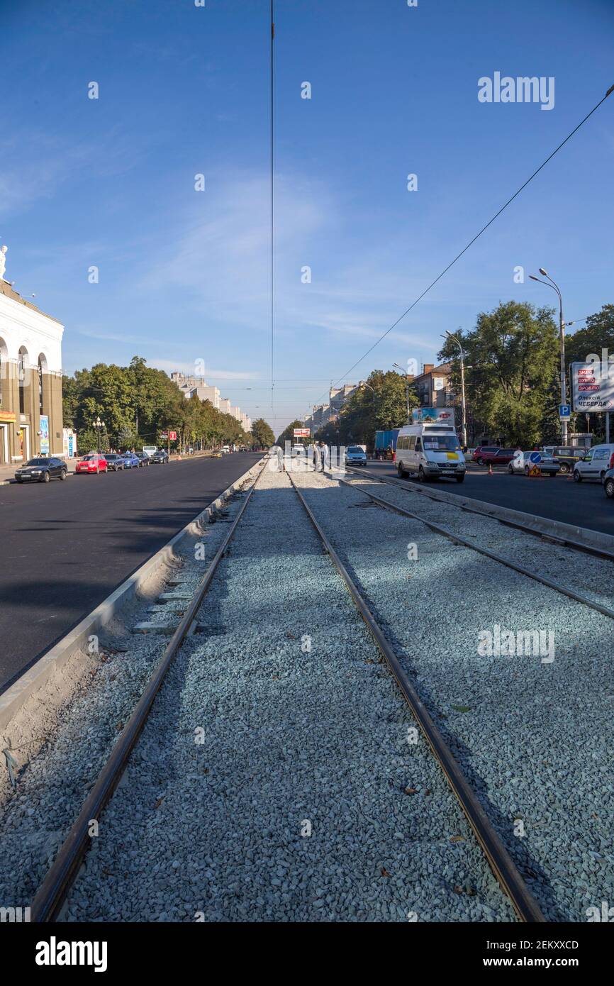 Dnipro, Ukraine - October 04, 2015: Laying of new asphalt and tram rails on Rabochaya street in Dnipro Stock Photo