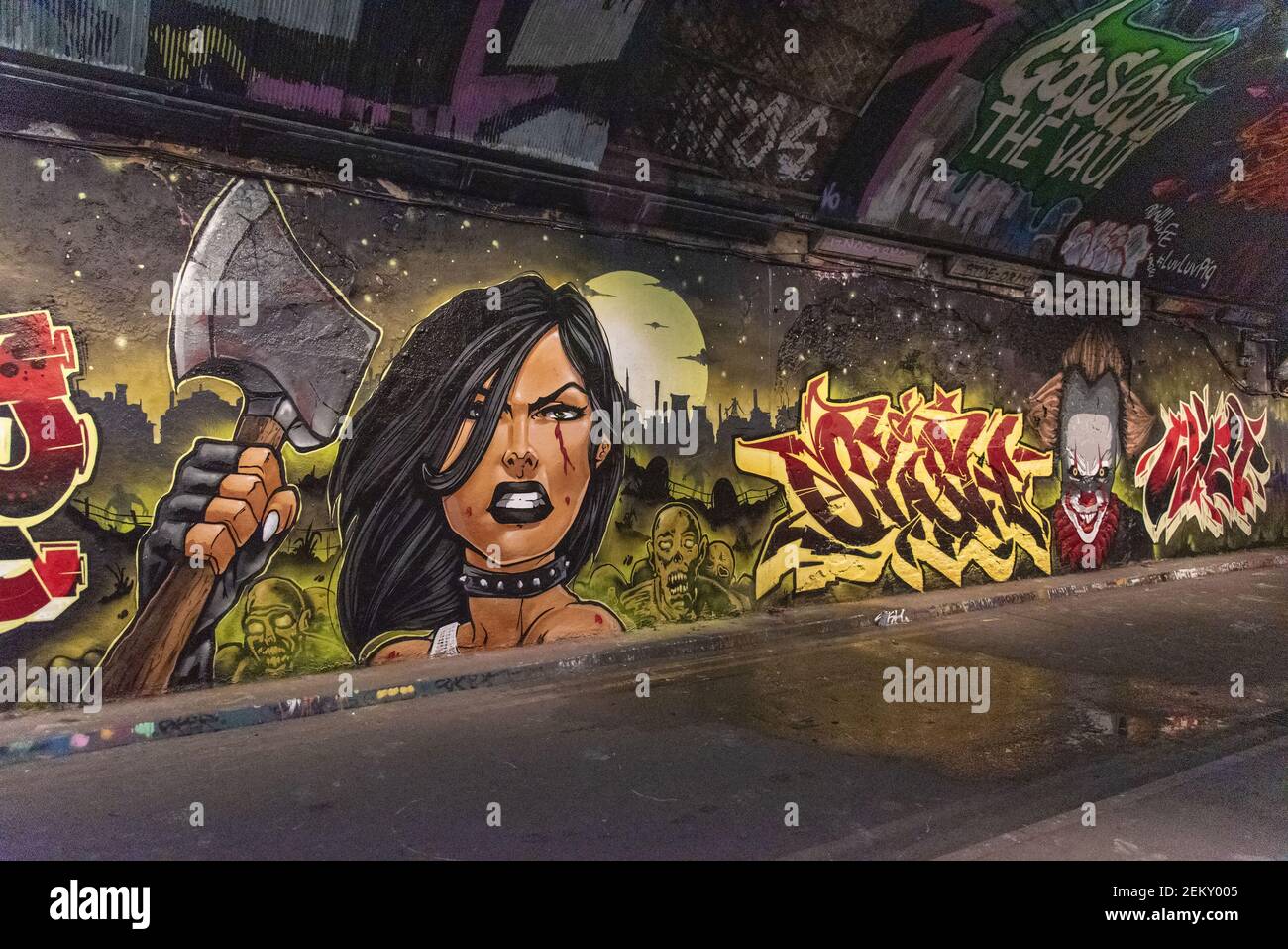 Graffiti of a woman with an axe part of the Halloween Paint Jam seen at the  famous Leake Street Tunnel under Waterloo station (Photo by Dave Rushen /  SOPA Images/Sipa USA Stock