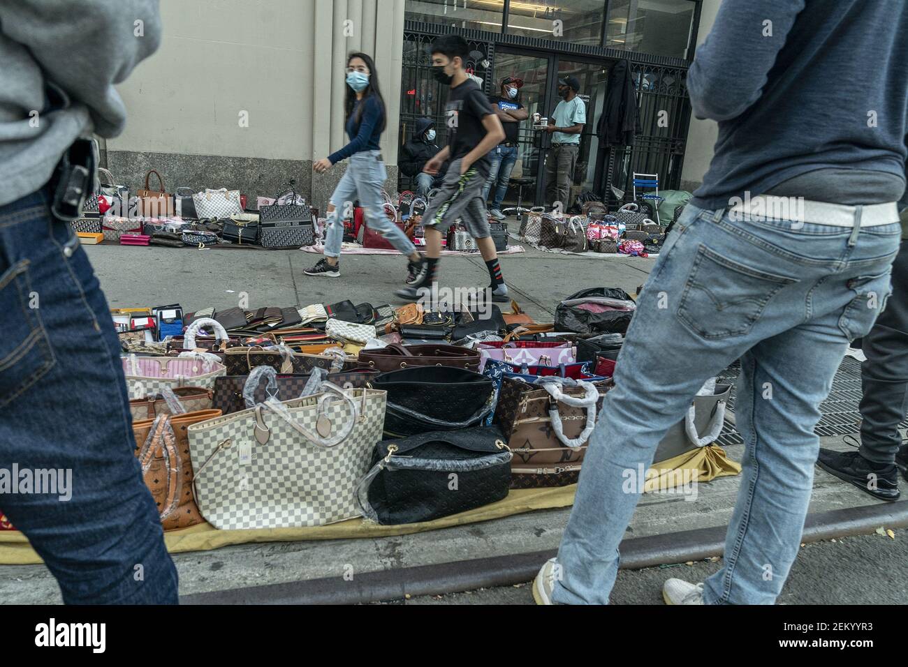 New York, NY - November 9, 2020: Street vendors sell counterfeits goods  like bags, sunglasses, belts and watches on Canal street and Broadway  corners Stock Photo - Alamy