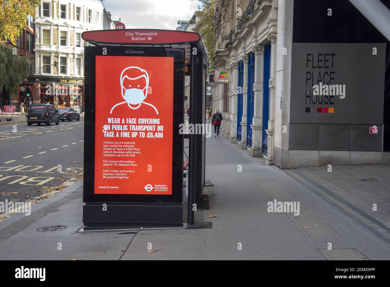 A sign warning to wear a face mask in public transport or face a fine ...