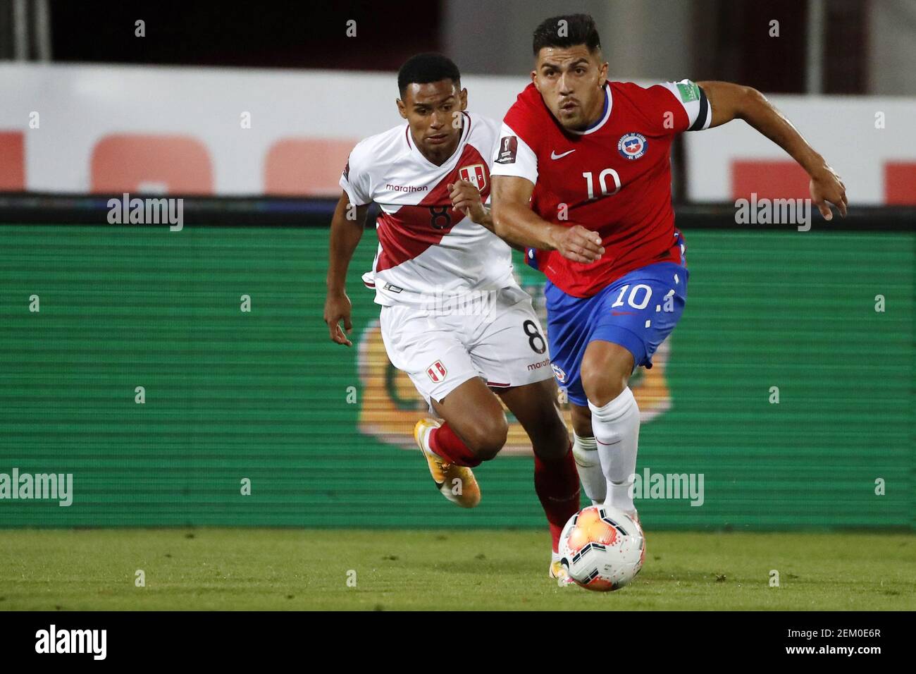 Cesar Pinares of Chile and Marcos Lopez of Peru during the World Cup ...