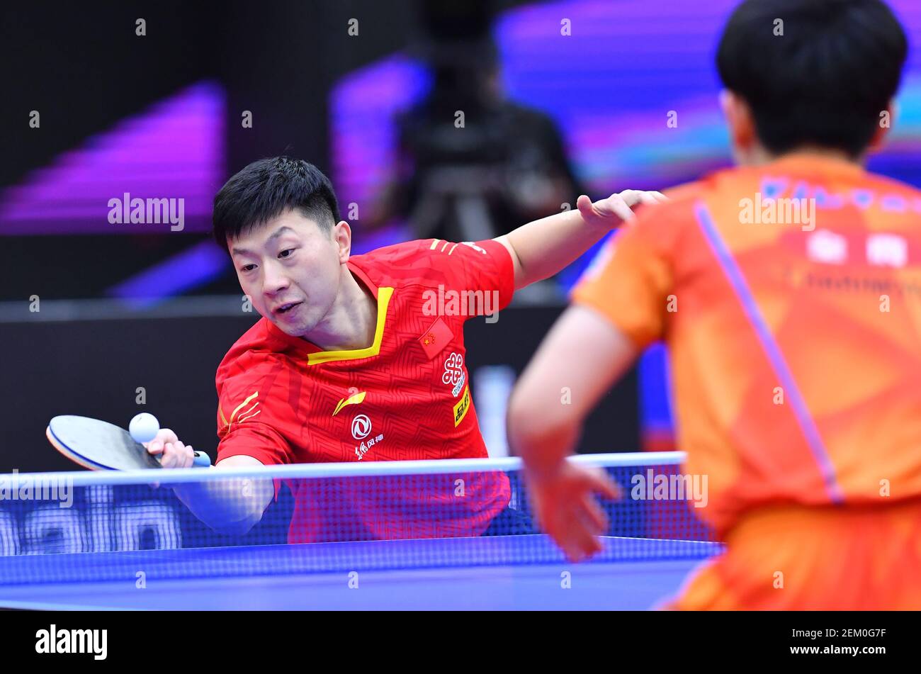 Chinese table tennis player Ma Long plays against Japanese table tennis