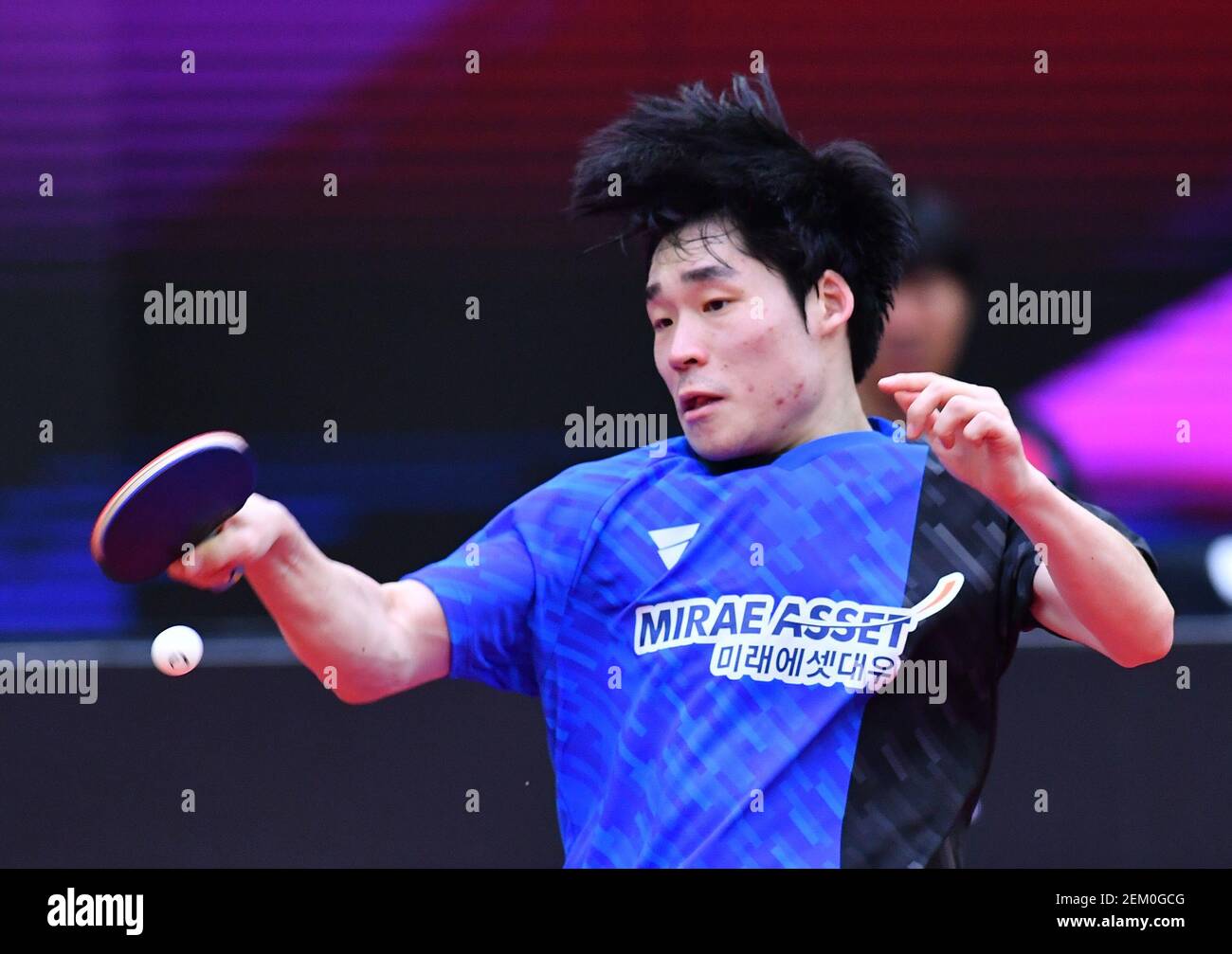 South Korean table tennis player Jang Woojin plays against Chinese