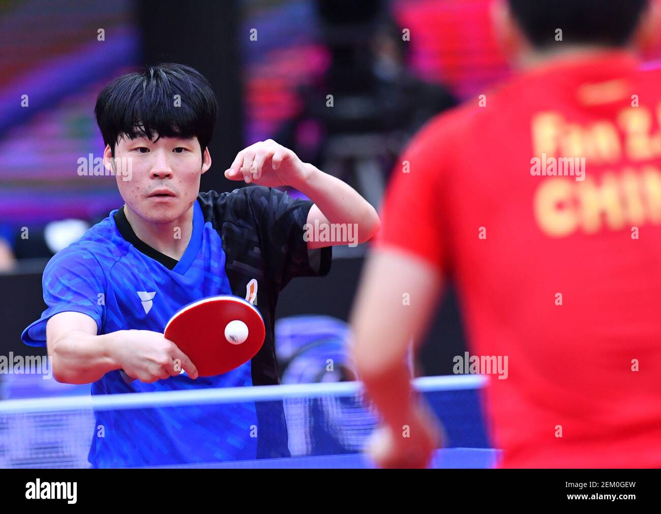 South Korean table tennis player Jang Woojin plays against Chinese