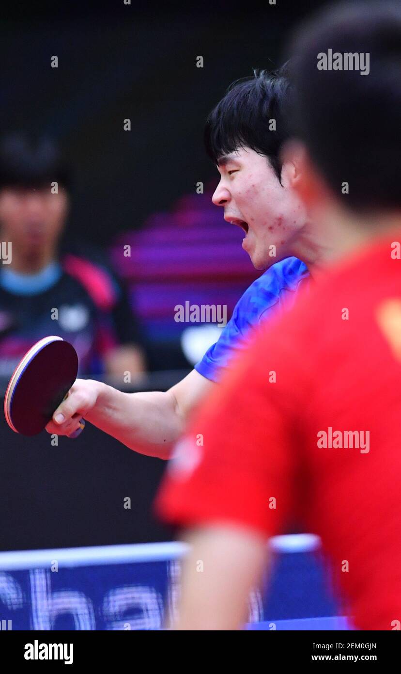 South Korean table tennis player Jang Woojin plays against Chinese