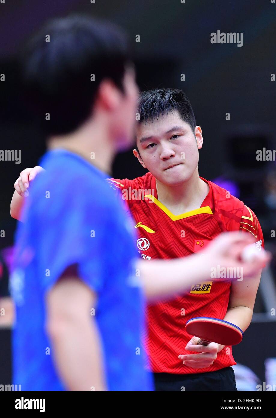 Chinese table tennis player Fan Zhendong plays against South Korean table tennis player Jang